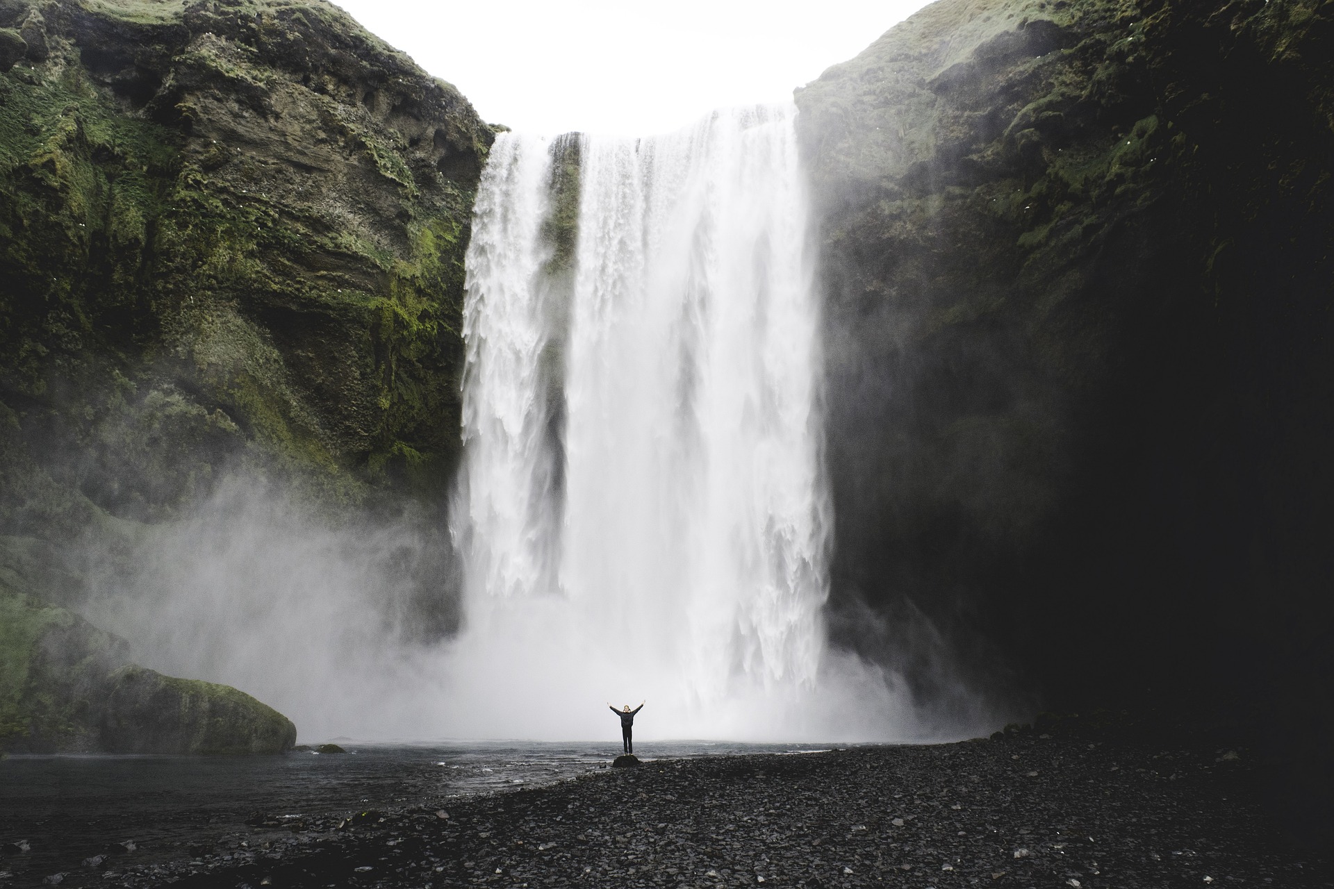 Majestic waterfall in Reykjavik, Iceland, cascading down with powerful force amidst breathtaking natural surroundings