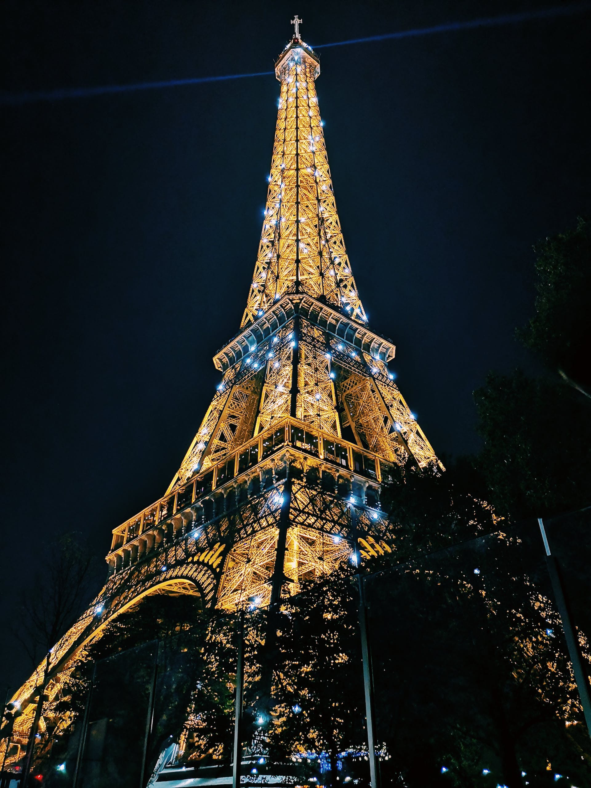 Paris Sparkle with Disney Charm | Iconic Eiffel Tower illuminated against the night sky, representing the enchanting allure of Paris Sparkle with Disney Charm."
