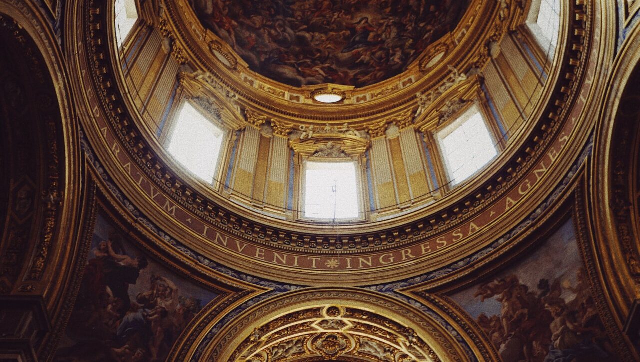 Romantic Roman Getaway | Interior view of a majestic hall in Rome, showcasing intricate architecture and historical grandeur.